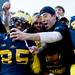 Michigan wide receiver Joe Reynolds, left, celebrates and takes a picture with fans after a football game at Michigan Stadium on Saturday afternoon. Michigan defeated Iowa 42 to 17.Joseph Tobianski | AnnArbor.com